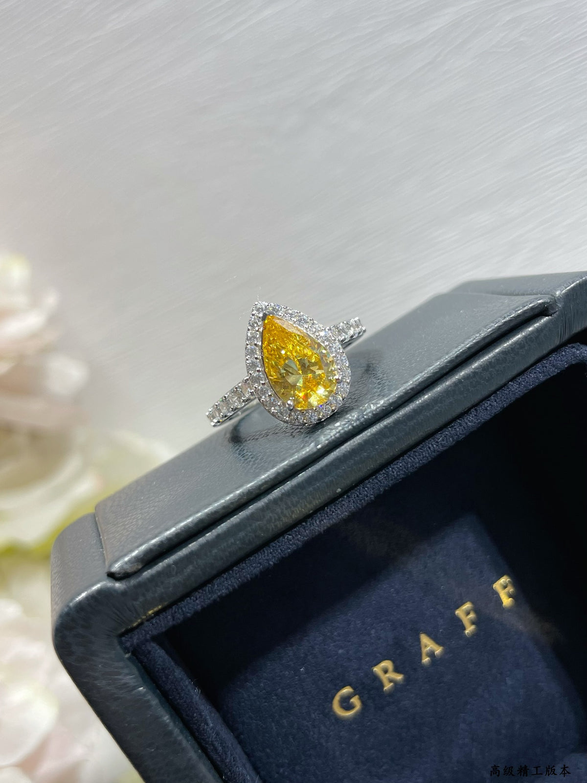 teardrop-shaped yellow diamond ring